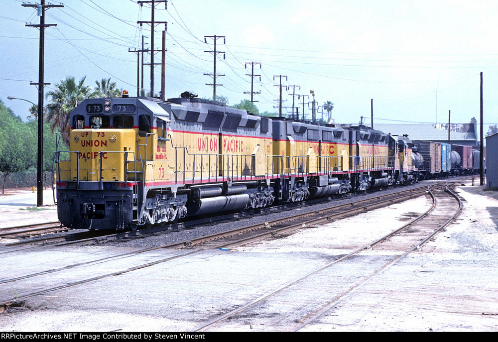 Union Pacific #73 West gets back on UP track at Riverside (old alingment).